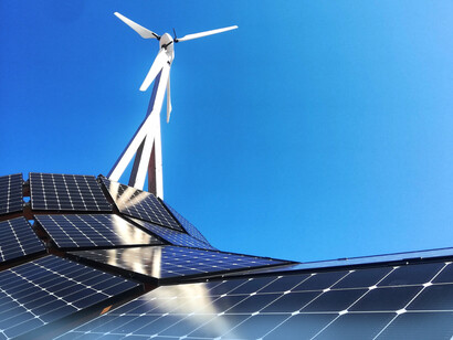 Solar panels and wind turbine work together for energy