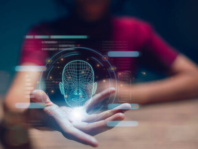 A person creating a replica of a human by matching facial movements, such as through face swapping or impersonation