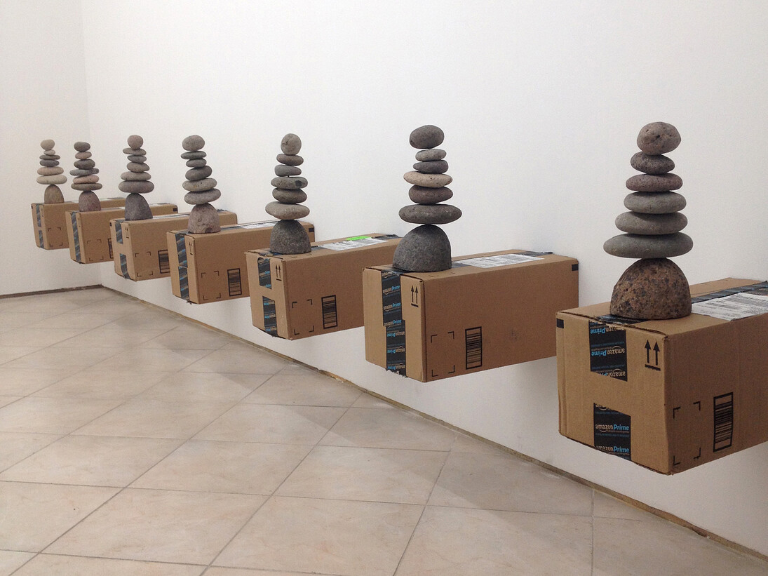 Daniel Keller, AmazonGlobalPriority Cairn Shelving Unit 1, 2013, Ancient Graffiti® river-stone cairns made in Honduras, original amazon.com shipping boxes, dimensions variable, Courtesy T293, Naples/Rome