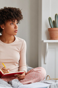 Starting the day with intention, she writes in her journal to clarify her goals and set a positive tone for what lies ahead