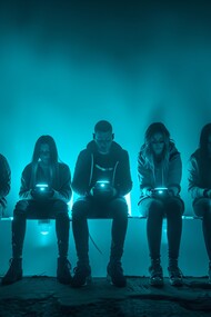 People absorbed in their smartphones, scrolling through their screens