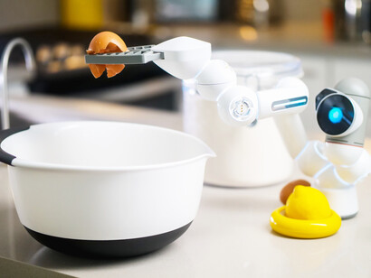 Adding eggs to the mixing bowl, an AI robot helps in the kitchen