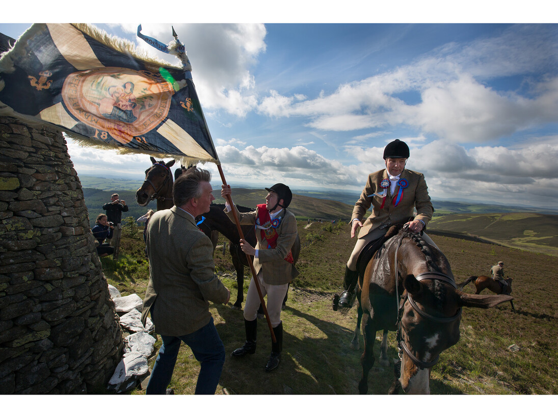 Jeremy Sutton-Hibbert, Royal Burgh Standard Bearer Martin Rodgerson and his Burleymen attendants, Three Brethren cairns summit, during the Common Riding festivities in Selkirk, Scotland, 2013 from the series Unsullied and Untarnished © Jeremy Sutton-Hibbert/Document Scotland