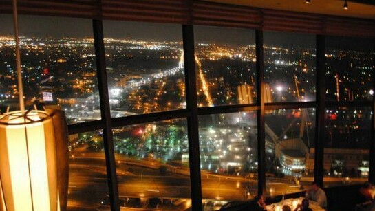 View of San Antonio from the revolving Chart House Restaurant at the Tower of the Americas at night.