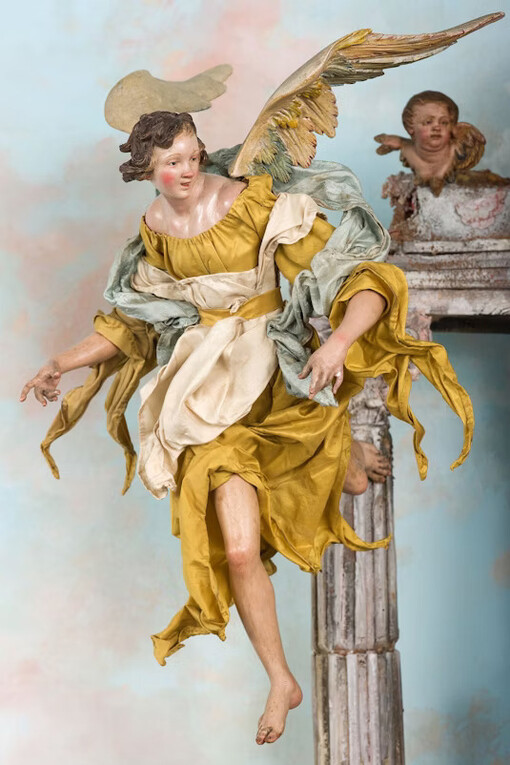 The Angels, In the Nativity story told in the Gospel of Luke, an angel appears to a group of shepherds to announce that a savior, Jesus Christ, will be born. Many more angels then appear, praising the savior and wishing peace and good will. Visualizing this moment, one of the angels above Joseph holds a silver scroll with the Latin phrase Gloria in excelsis Deo  (“Glory to God in the highest”). Courtesy of the Art Institute of Chicago