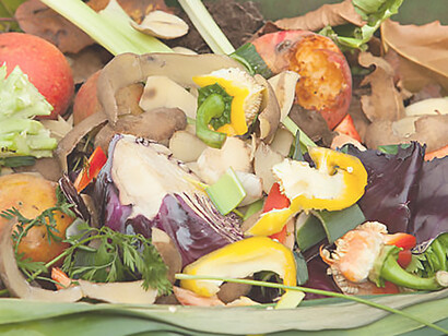 Environmentally friendly and sustainable lifestyle with a compost bin featuring layers of organic matter and soil