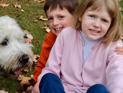 Amy Daniels' two children and dog at their new house