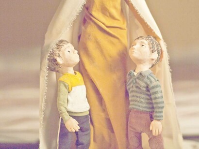Two young boys with their protective mother from the movie "Ayny" written and directed by Ahmed Saleh