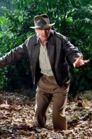 In this Indiana Jones movie, he is standing in quicksand, waving them off