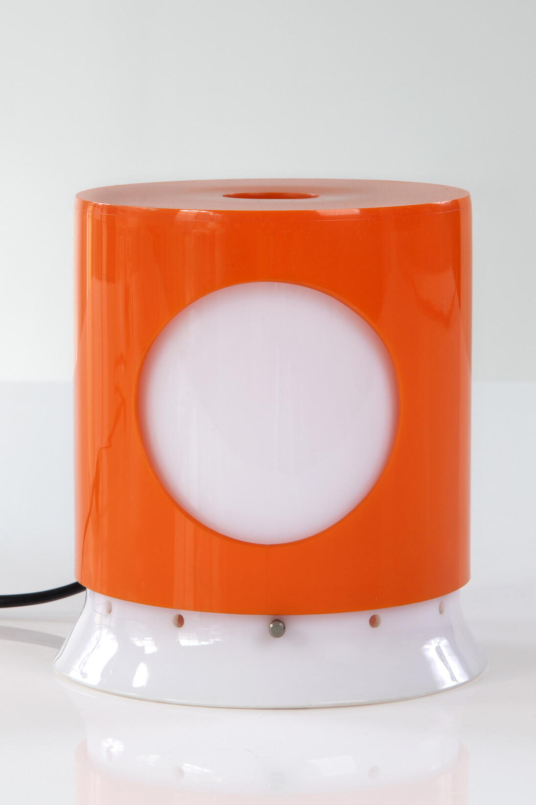 "Lamp with Rotating Shade" in white and colored Polystyrene plastic. Designed by Joe Colombo for Kartell, 1965. 5" L x 5" W x 6" H. Photo by Sherry Griffin for R & Company