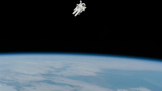 An astronaut floating on space with the Earth as background