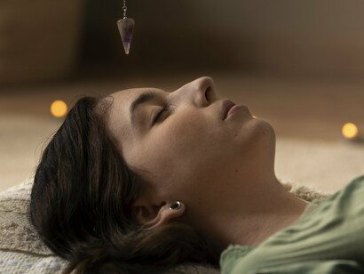 With calm etched into every feature, a woman enters the stillness of self-renewal