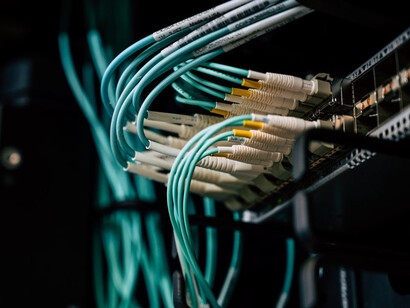 As cables intertwine within a WiFi router, they represent the ongoing efforts to overcome the digital divide in South Africa, ensuring equal access to technology for all communities