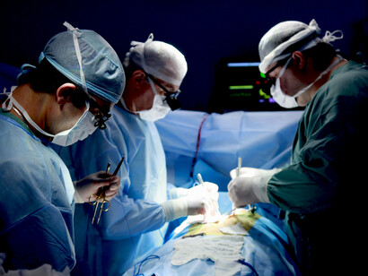 Medical team performing surgery in the operating theatre
