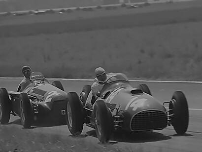 Giuseppe "Nino" Farina in Alfa 159 (#2, ended in 5th place) chasing José Froilán González (#14, ended in 2nd place, co-driven by Ascari) in Ferrari 375 F1 at 1951 French GP, on 1 July 1951