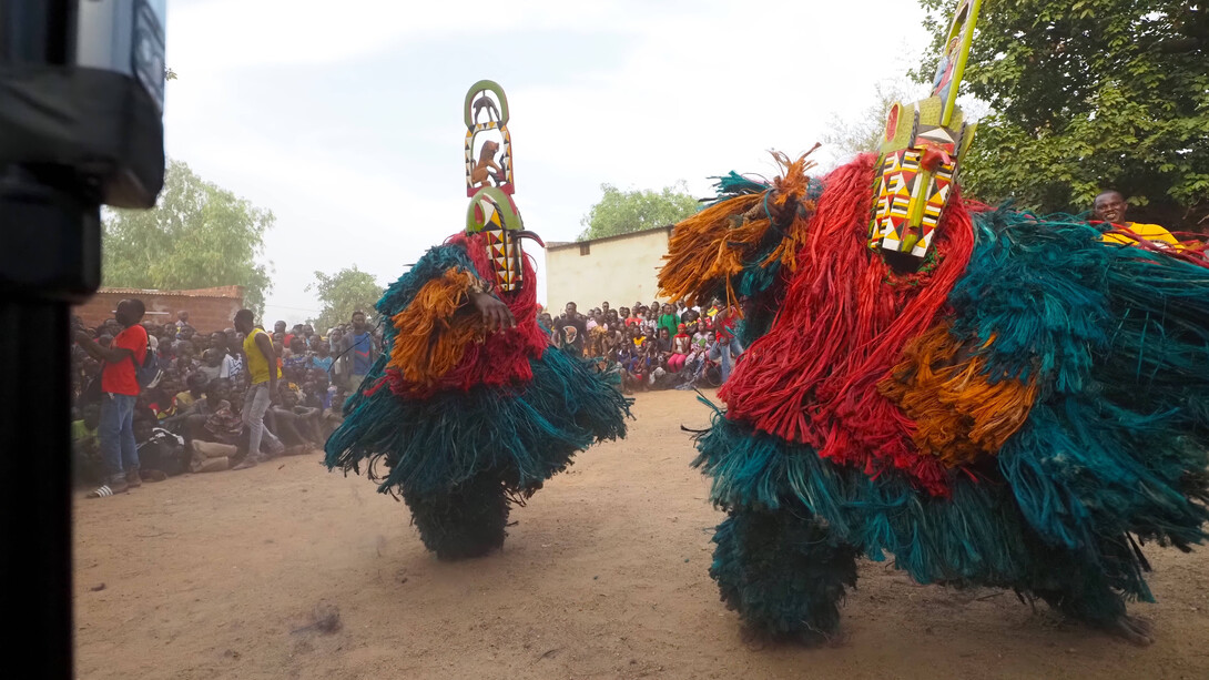 Hervé Youmbi, Bamiléké-Kwele Ku'ngang gorilla mask and single-faced rhino mask, during a ceremony in Fondanti village, 2019. Courtesy of San Antonio Museum of Art