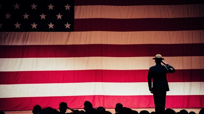 Men salute to the American flag