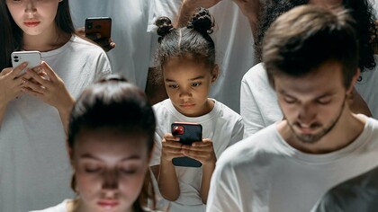 Young couple addicted to their phone screens