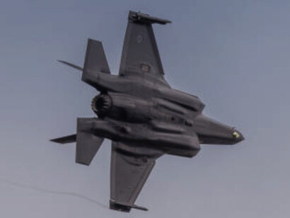 F-35 Lightning II fighter jet in mid-flight, showcasing its advanced design