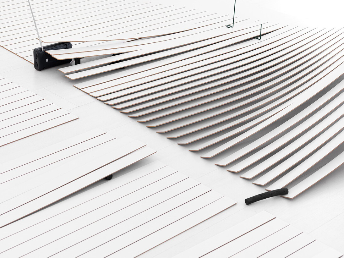 Beatriz Olabarrieta, News Plast, 2014, Laminated Hardboard Board , plasticine blocks, charcoal sticks, elastic, plant supports, raphia rope, shoelaces, palette, Sony radio switched. 5 x 3 m, Courtesy Casado Santapau Galeria, Madrid  