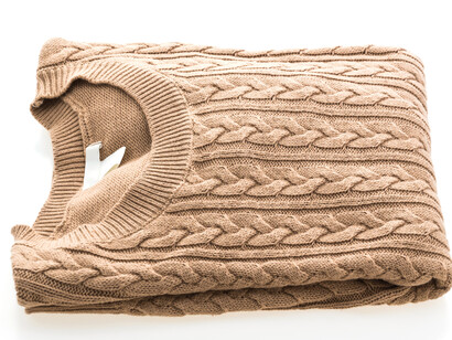 The Aran sweater, an iconic symbol of Irish craftsmanship, elegantly displayed for all to admire
