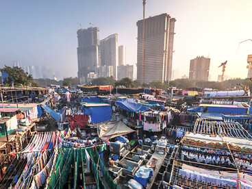 View of Mumbai’s luxury high-rise buildings from a nearby slum in the Bandra suburbs
