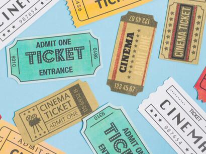 Top view of a collection of cinema tickets, representing the anticipation of a movie outing