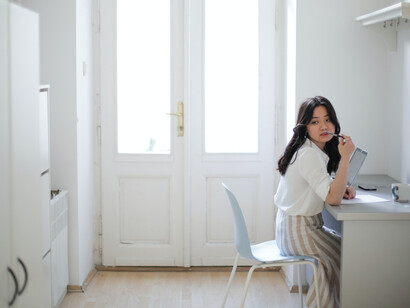 Girl sits at her desk studying