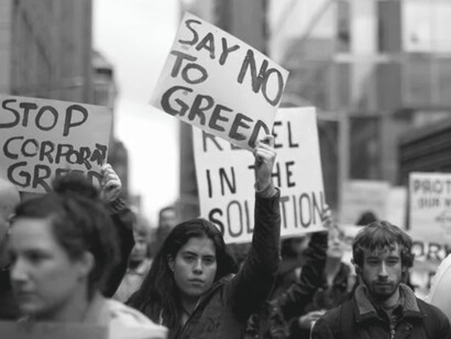 Anti-corporate greed protesters march together