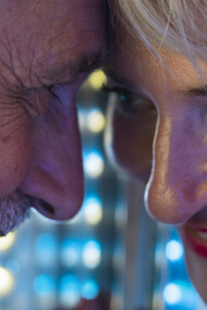 Happy couple sharing a tender moment, looking at each other closely with affection