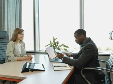 A man interviews a job applicant during a professional interview
