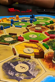 Embark on an exciting journey as players set up The Seafarers of Catan board, expanding the gameplay in this thrilling extension of the popular "The Settlers of Catan" board game