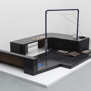 Magali Reus, In Place Of (Sundries), 2015. Black waxed and clear waxed Jesmonite, black waxed polyester resin, silicone rubber, polyurethane rubber, latex, powder coated laser cut steel, phosphated and powder coated steel, steel rod, magnets, sanded paper, polyurethane plastic, fabric, air brushed polyester resin, polyurethane resin, putty wax, vinyl. Part 1: 141 x 188 x 90 cm 