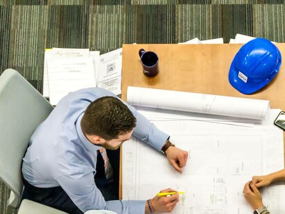 Monitor and evaluation officer drafting a plan