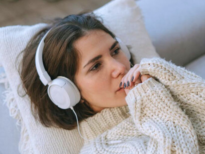 In the stillness of the room, she finds a cathartic release, illustrating how music can evoke profound healing and reflection