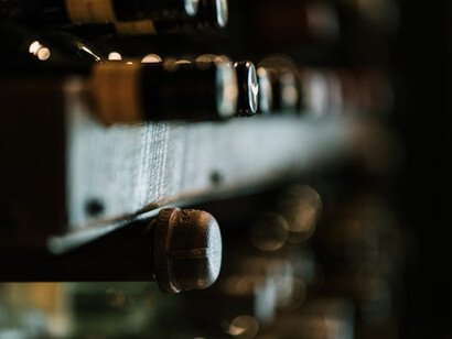 A beautifully arranged wine rack at an esteemed wine competition, where experts gather for tasting and awards