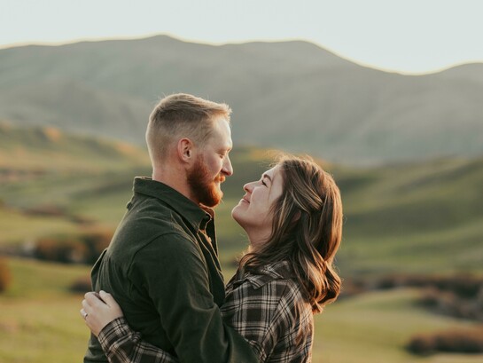 A couple embracing while gazing into each other’s eyes
