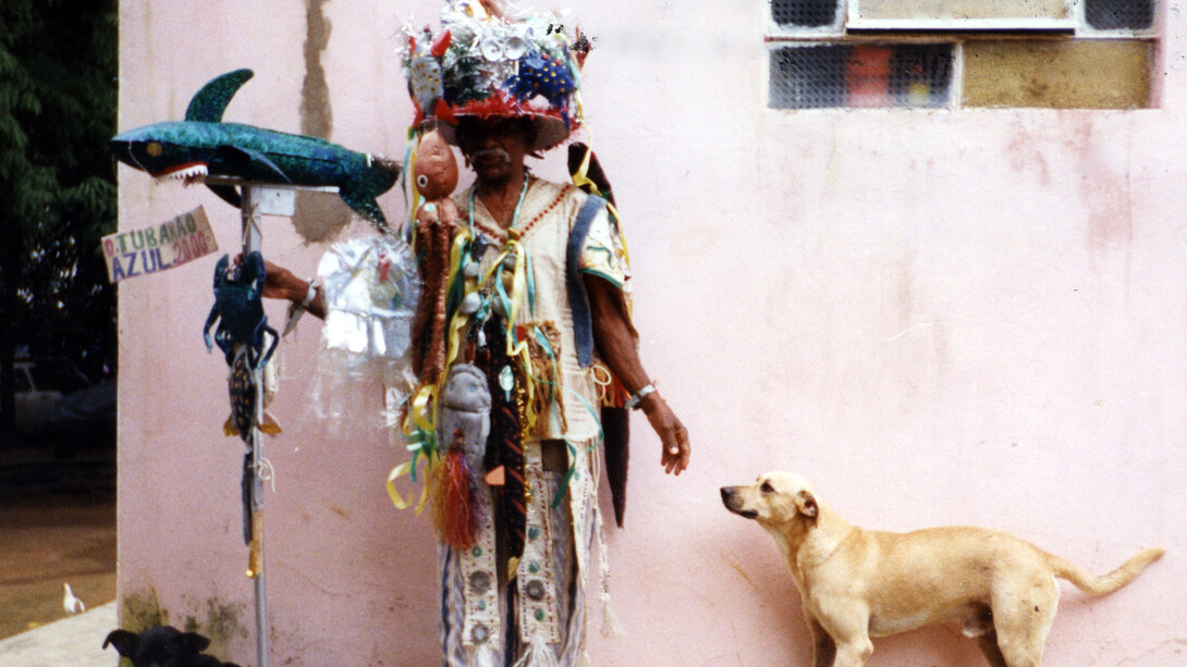 Photo by Dimitri Ganzelevich, Raimundo Borges Falcão (dates unknown) in his carnival disguise at Carnival Fantasia “Blue Shark”, Near Salvador, Bahia, Brazil, 2000, Color photograph, 7 x 5", Courtesy Beate Echols