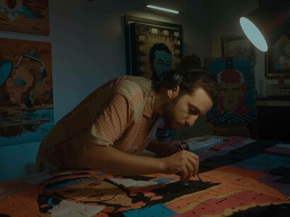 Youness Miloudi applying the finishing touches on his latest artwork photo by Walid Biya