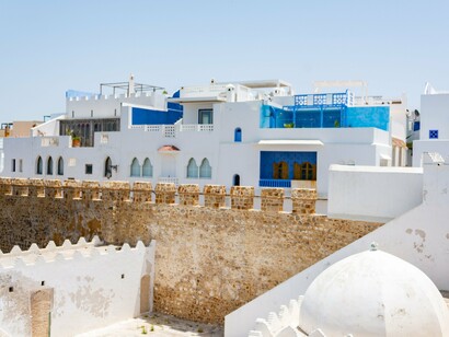 Traditional white buildings and blue accents in Asilah, Morocco, reflecting the country’s rich coastal heritage and strategic Mediterranean setting