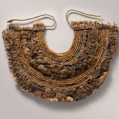 Period:New Kingdom
Dynasty:Dynasty 18
Reign:reign of Tutankhamun
Date:ca. 1336–1327 B.C.
Geography:From Egypt, Upper Egypt, Thebes, Valley of the Kings, Embalming cache of Tutankhamun (KV 54), Davis/Ayrton excavations, 1907
Medium:Papyrus, olive leaves, persea leaves, cornflowers, blue lotus petals, Picris flowers, nightshade berries, faience, linen
Dimensions:H. 17 cm (6 11/16 in.); W. 40 cm (15 3/4 in.); Diam. of faience disk beads 0.5 cm (3/16 in.)
Mount: W. 48.9 cm (19 1/4 in.); D. 41.9 cm (16 1/2 in.); H. 7 cm (2 3/4 in.)
Credit Line:Gift of Theodore M. Davis, 1909