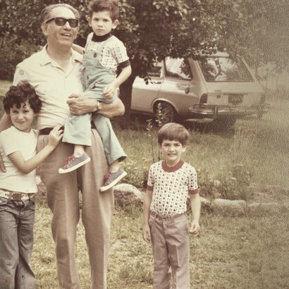 Dr. Felix Eduardo Herrera and his three grandchildren after they were reunited