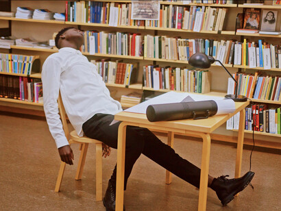 Despite the exhaustion, he remains committed to his work, illustrating that success is built on hard work and the relentless pursuit of knowledge, not just the passage of time