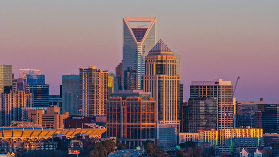 A skyline dominated by corporate giants symbolises our current path of unsustainable growth and inequality, where global decisions echo in boardrooms rather than communities