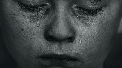 A young boy consumed by shame