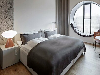 Scandinavian minimalism layered with warmth and tactile comfort