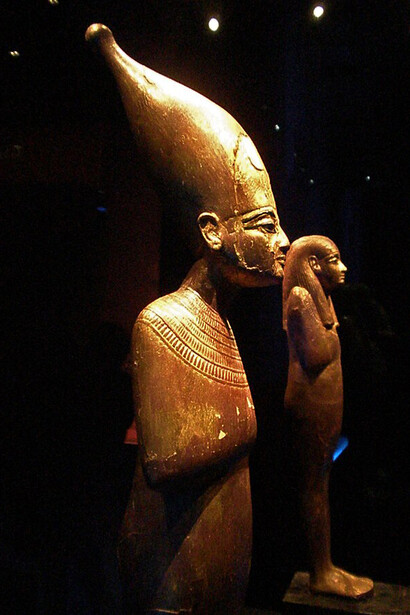 Gilded wooden figure of Tata on inscribed wooden pedestal. Gilded wooden figure of Sened on inscribed wooden pedestal