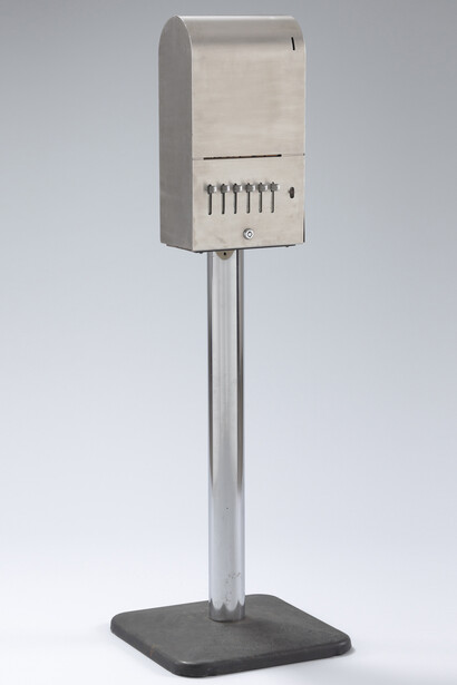 Yoko Ono (Japanese, born 1933), Sky Machine. 1961/1966. Stainless steel dispenser, metal pedestal, and handwritten cards. Dispenser: 51 3/16 x 16 1/8 x 16 1/8″ (130 x 41 x 41 cm); card (each): 1 x 1 3/4″ (2.5 x 4.5 cm). The Museum of Modern Art, New York. The Gilbert and Lila Silverman Fluxus Collection Gift, 2008.
© Yoko Ono 2014