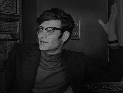 The poet Mahmoud Darwish engaging in discourse in a café in Palestine