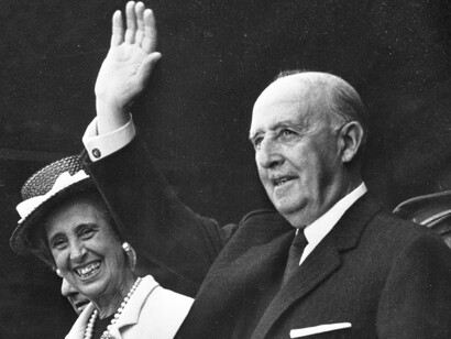 Francisco Franco and his wife Carmen Polo waving at the public